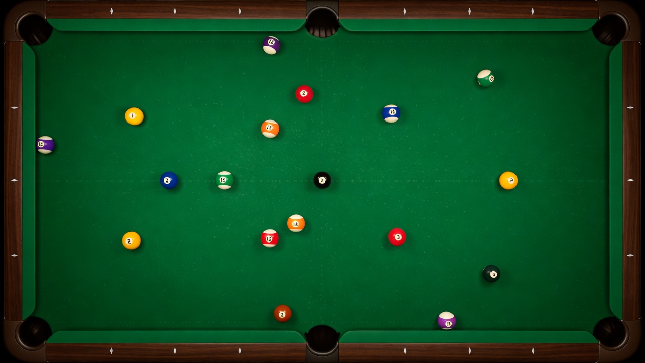 Overhead shot of 8-ball and colorful solids and stripes on tournament pool table